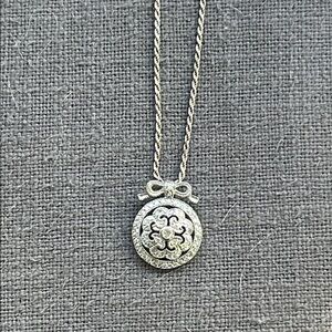 Sterling bow pendant with czs